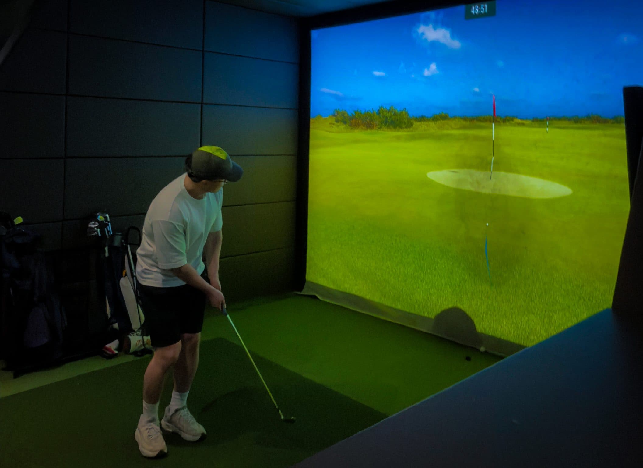 A member lining up a shot in a Golf.One bay